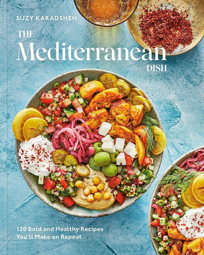 book cover of The Mediterranean Dish displaying a chicken and vegetable bowl on blue background
