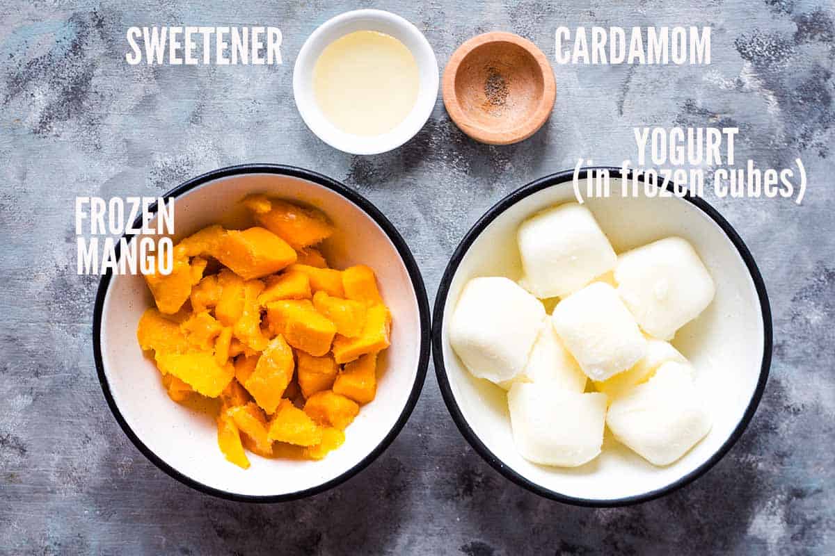ingredients for mango frozen yogurt laid out in individual bowls