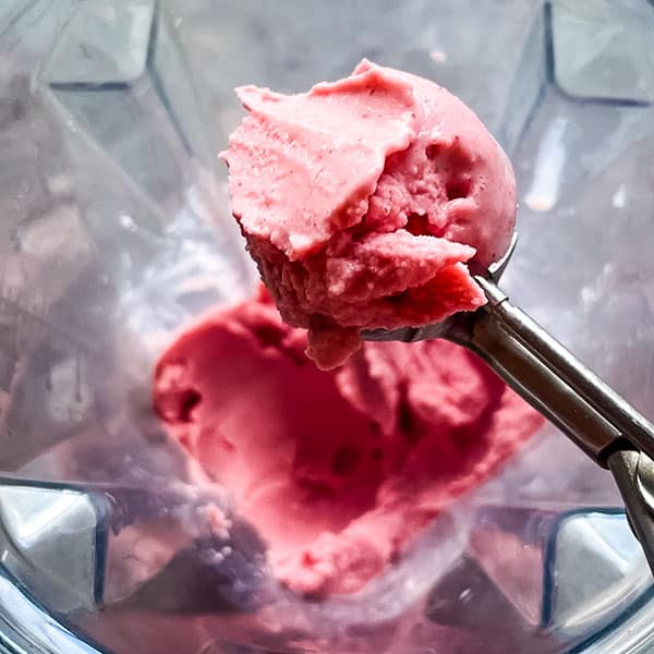 scooper with strawberry yogurt ice cream