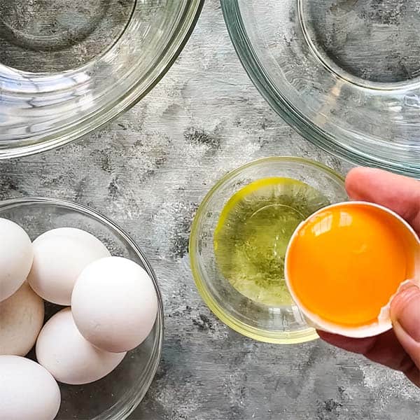 separating egg whites and egg yolks into different bowls