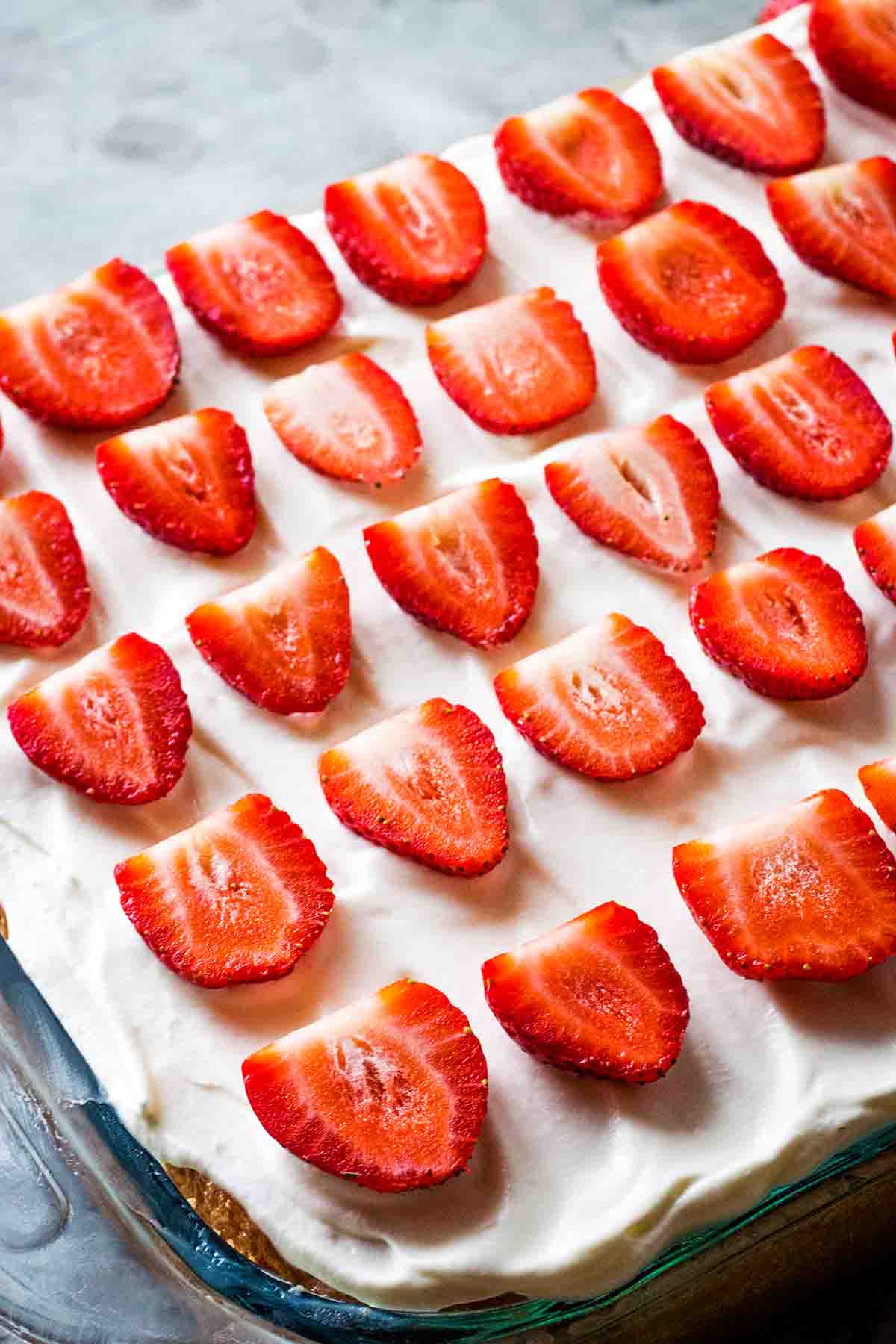 Tres leches cake with fresh strawberry topping
