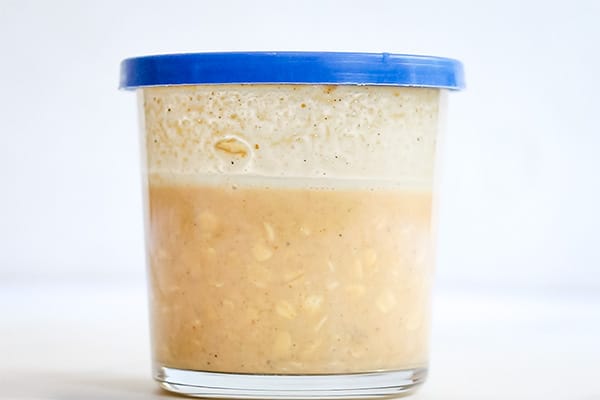 stirred up pumpkin spice overnight oats in glass jar with blue lid
