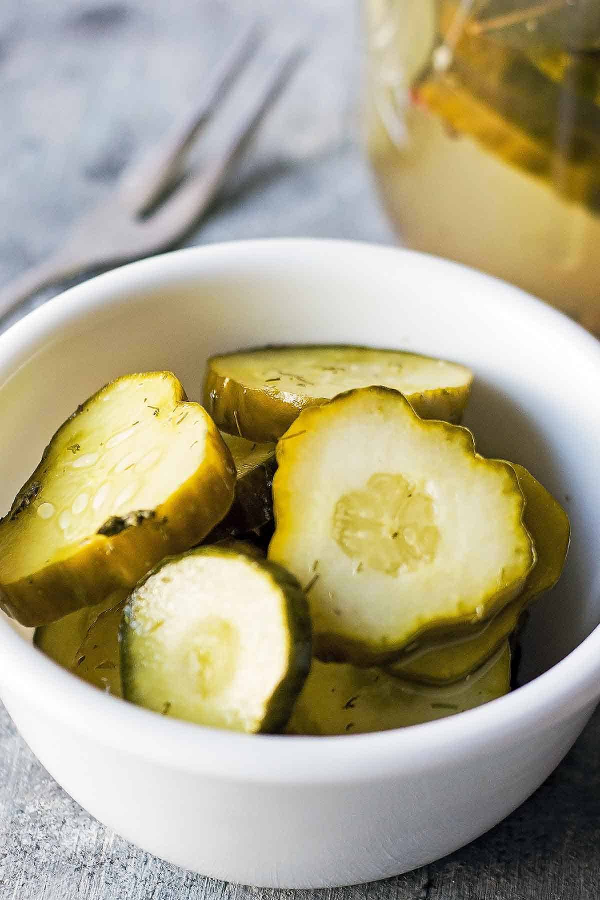 easy fermented cucumber slices in small white bowl