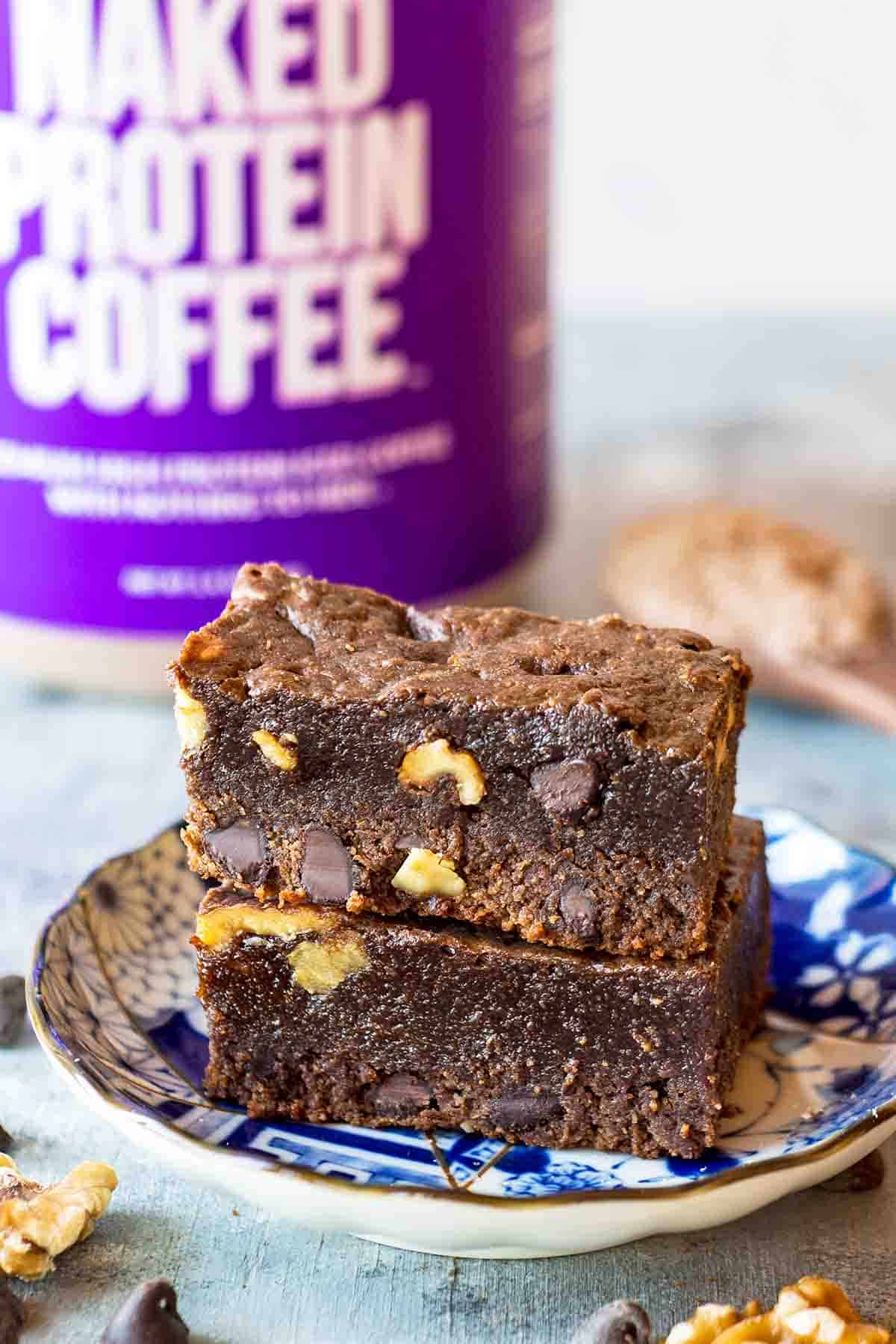 chocolate protein powder brownies in small saucer