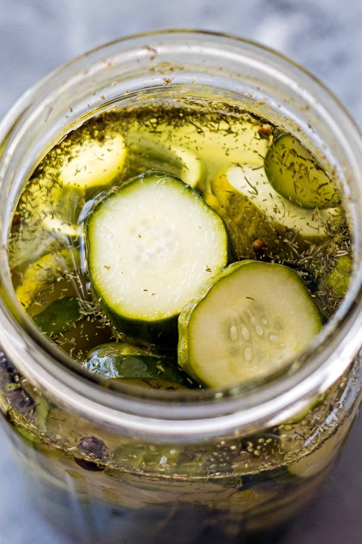 Refrigerator dill cucumber pickles slices in mason jar