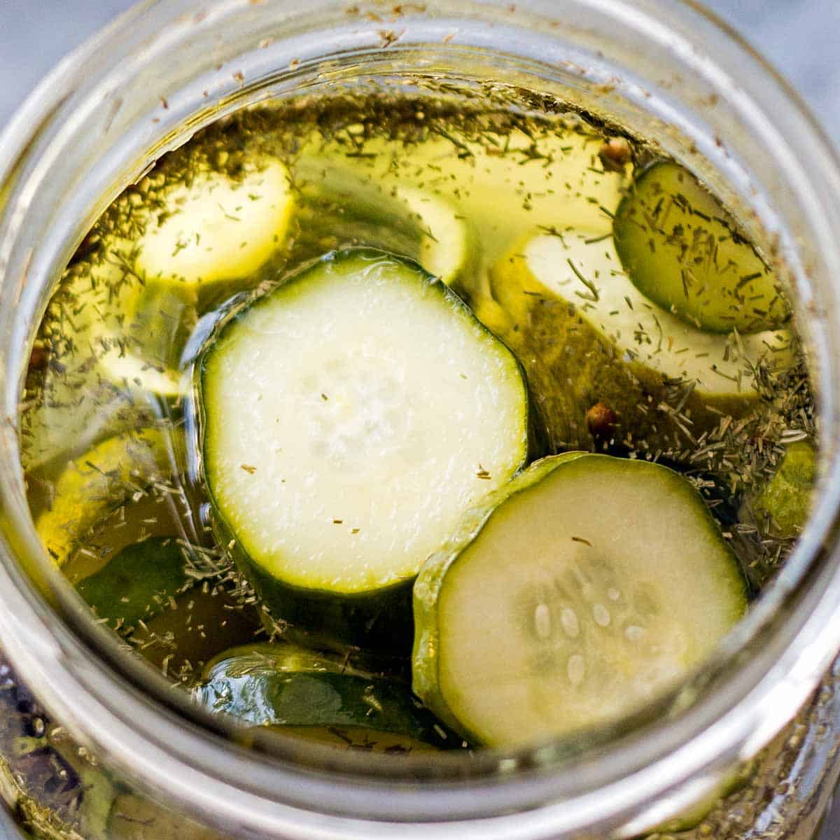 open jar of cucumber pickle slices