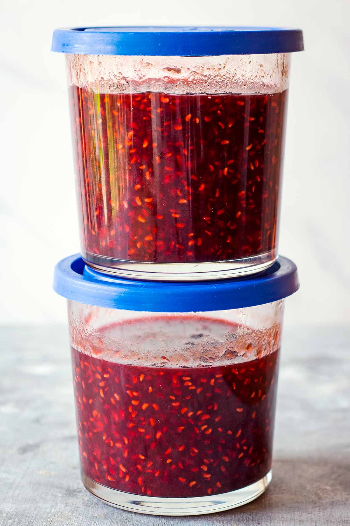 two jars of raspberry preserve