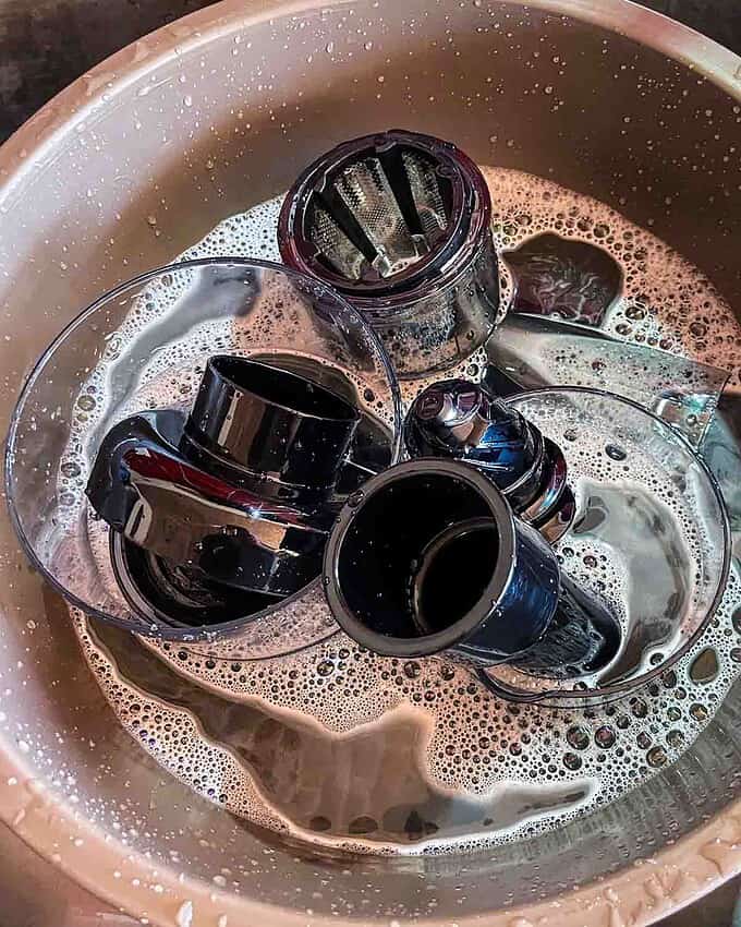 all juicer parts in warm soapy water