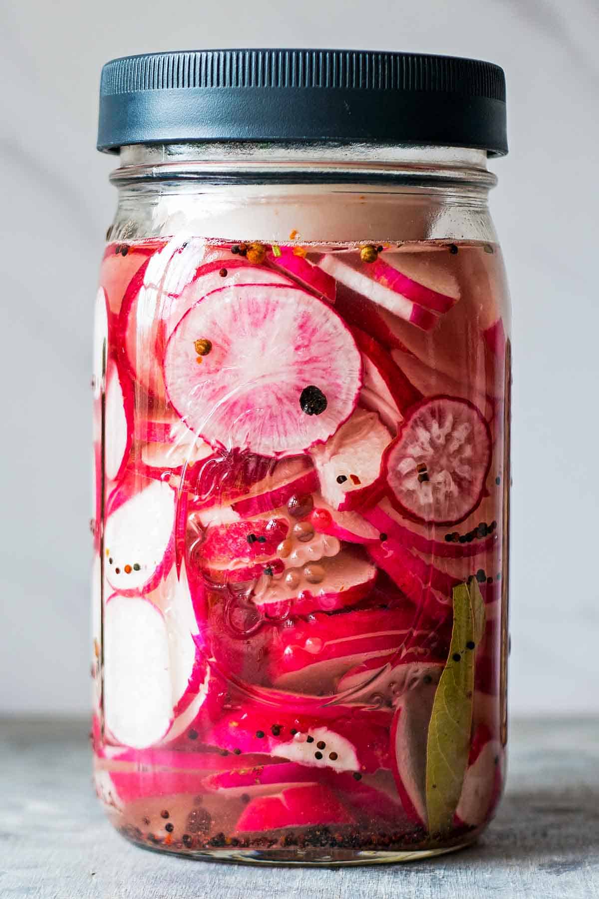 pink radishes in jar