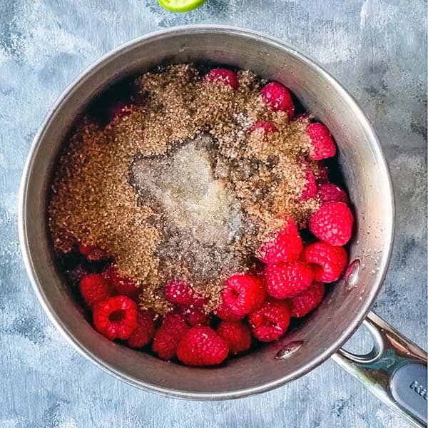 raspberry jam ingredients in saucepan