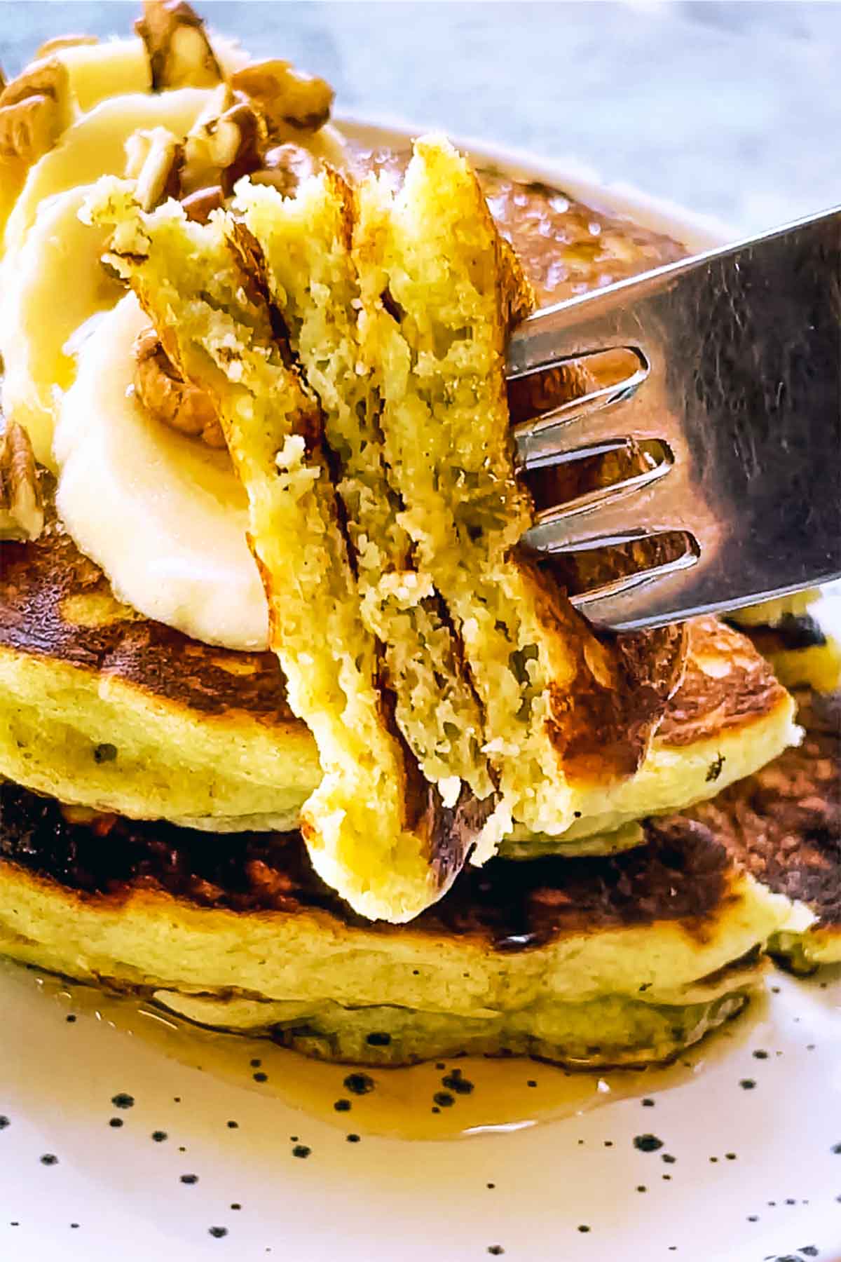 bite of protein pancakes on fork