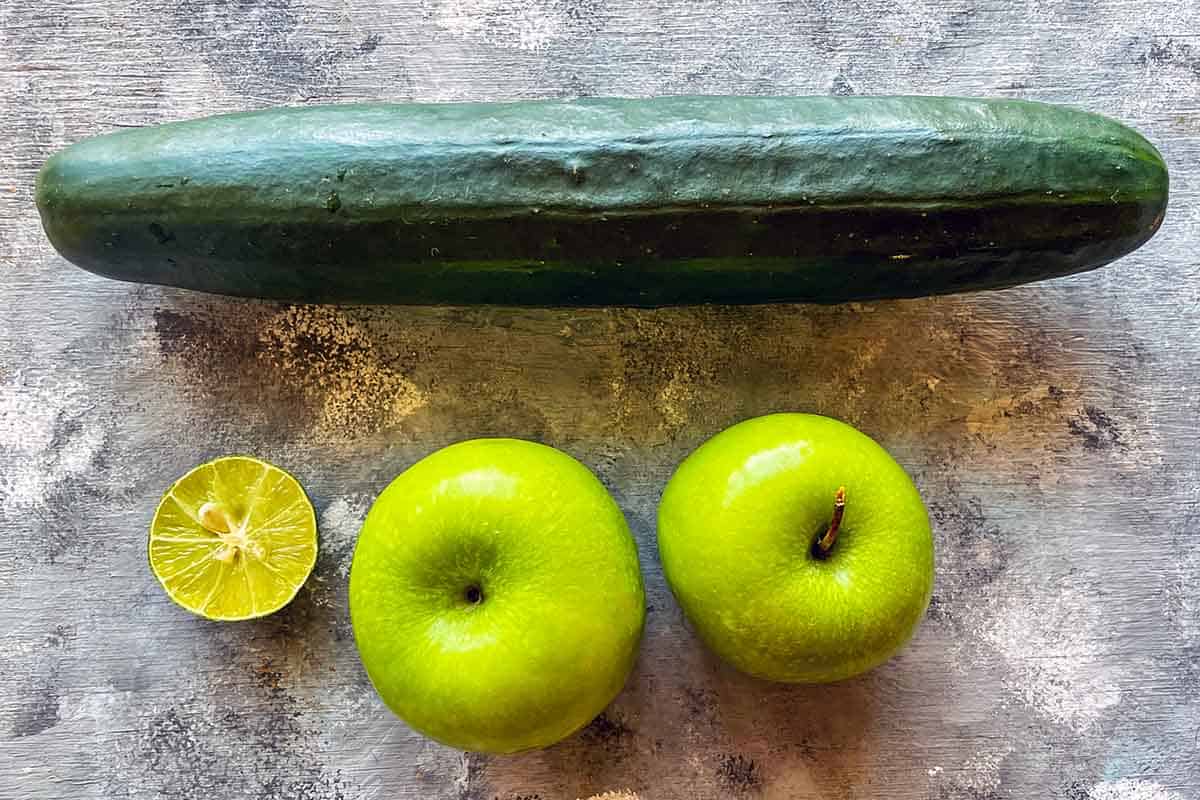 ingredients for cucumber apple juice laid out