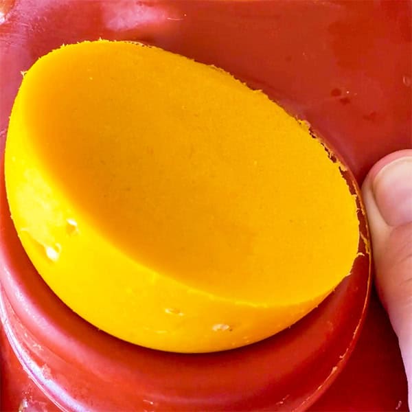 unmolding mango sorbet scoops