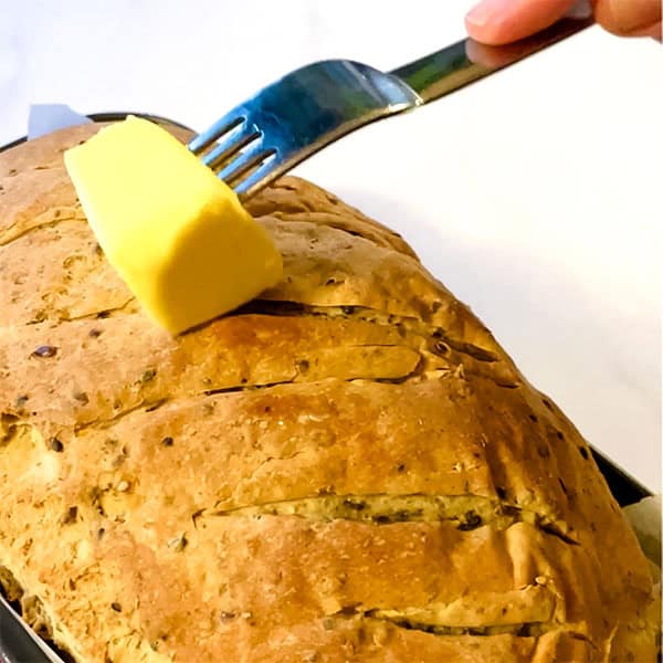 brushing bread with butter